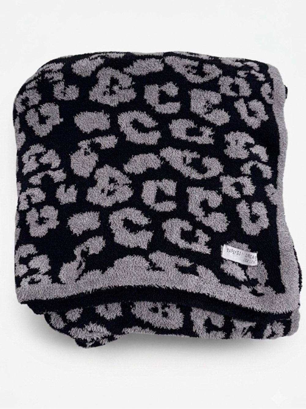 Barefoot Dreams CozyChic Barefoot in the Wild Throw Blanket in Charcoal Leopard